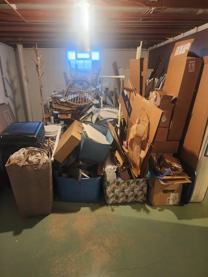 Roll-off dumpster container at job site for 8 Yard Dumpster Rental in Spring Lake